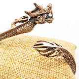 Drachenarmreif aus Bronze mit beweglichem Drachenkopf
