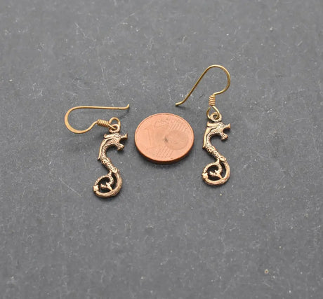 Keltische drachen-ohrringe aus bronze - ohrringe