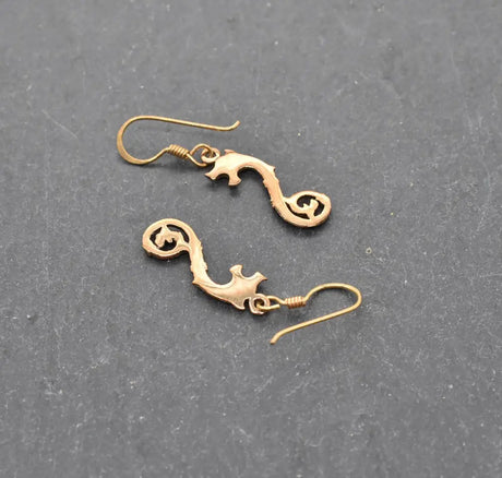 Keltische drachen-ohrringe aus bronze - ohrringe