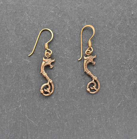 Keltische drachen-ohrringe aus bronze - ohrringe